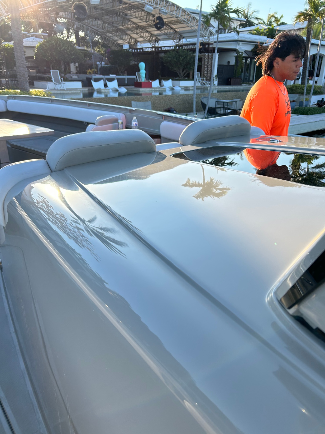 AC Detailing crew finishing a center console deck at a private marina
