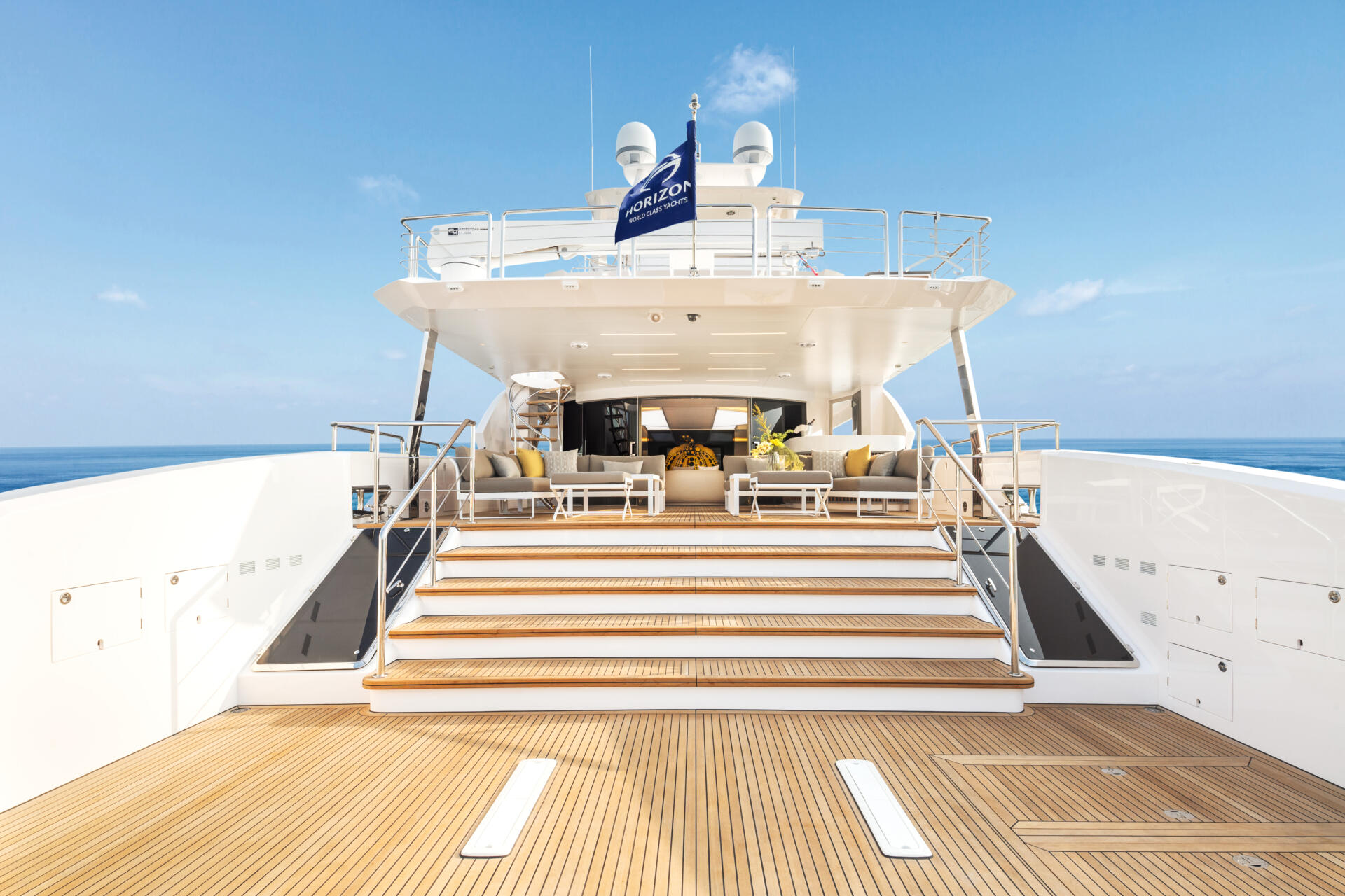 Freshly restored teak decking on a motor yacht's main deck aft