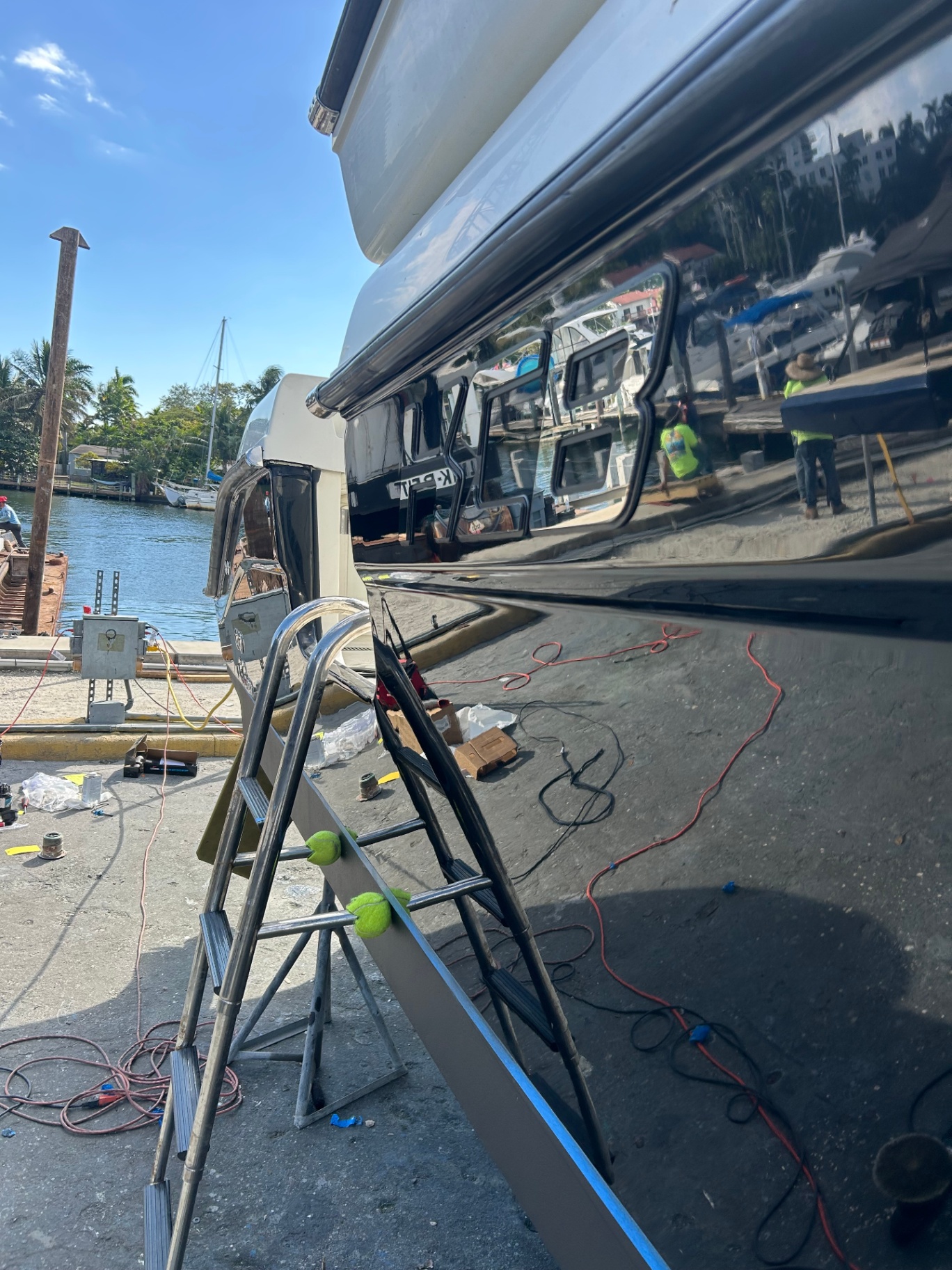 Black gelcoat transom polished to mirror finish at the yard